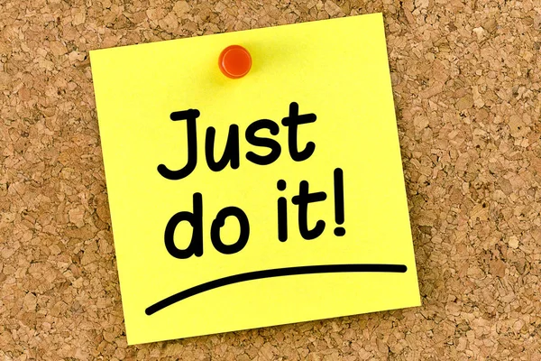 Closeup note on corkboard with just do it message on it — Stock Photo, Image