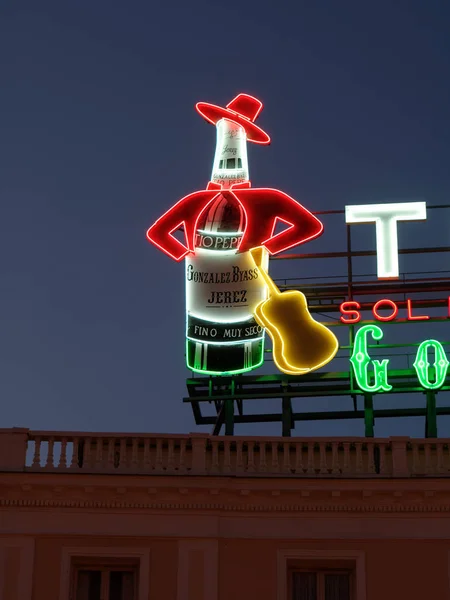 Closeup of Tio Pepe famous brand of Sherry sign neon at night in Puerta del Sol — Stock Photo, Image