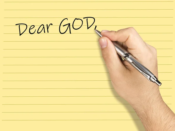 Closeup hand writing letter to GoD on lined sheet — Stock Photo, Image