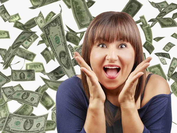 Mujer feliz regocijándose bajo la lluvia de dinero EE.UU. dólares aislados en blanco — Foto de Stock