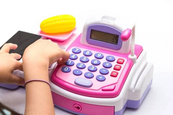 Little girl fingers pressing toy calculator — Stock Photo, Image