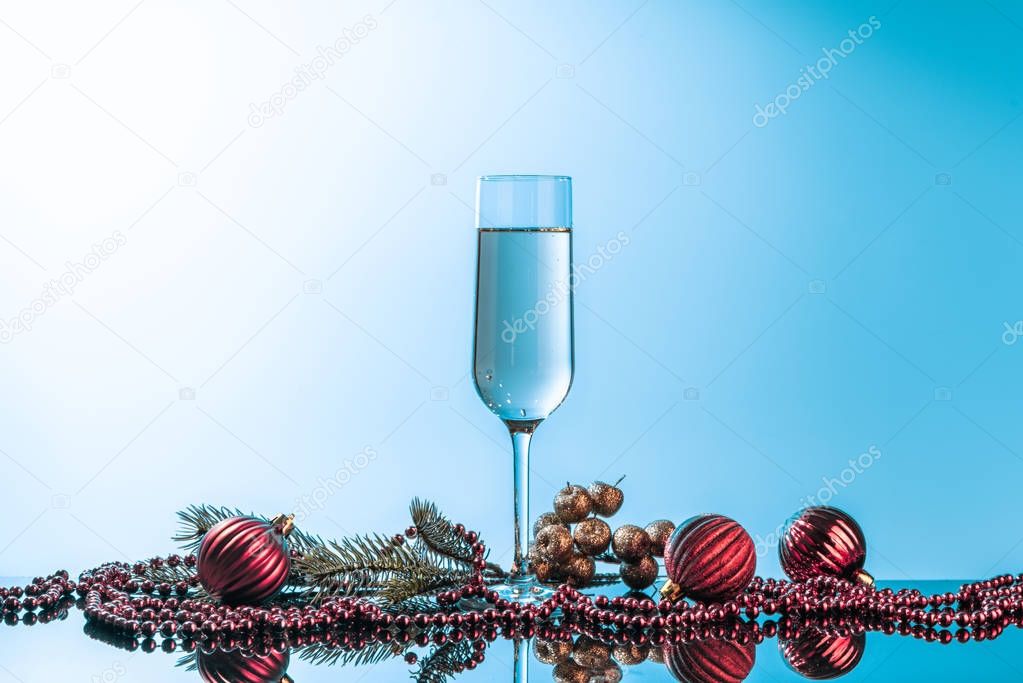 Glass of champagne on neon background. 