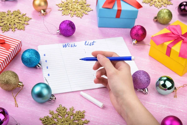 Christmas wish list on pink background. — Stock Photo, Image