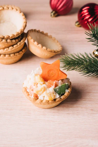 Mini crab salad tarts on wooden background. — Stock Photo, Image