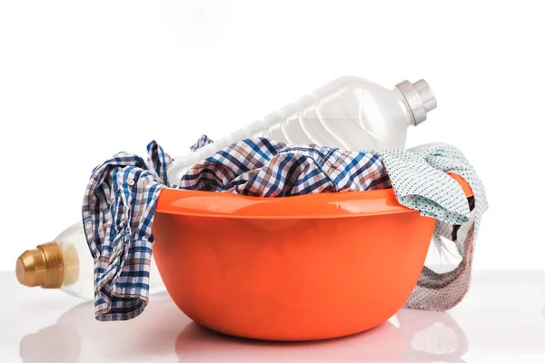 Clothes in a laundry orange basket. — Stock Photo, Image