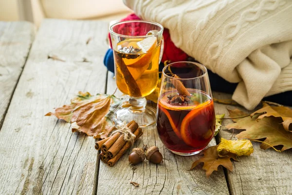 Selection of autumn drinks on wood background