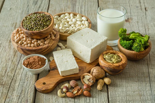 Selection vegan protein sources on wood background — Stock Photo, Image