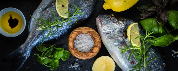 Raw fish with herbs and spices — Stock Photo, Image