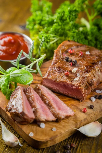 Beef steak with herbs and spices — Stock Photo, Image