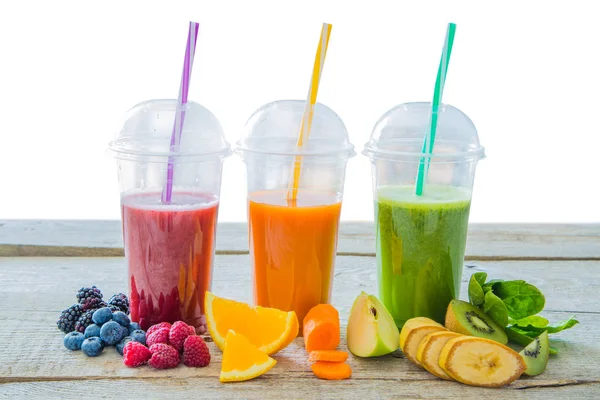 Selection of colourful smoothies on rustic wood background — Stock Photo, Image