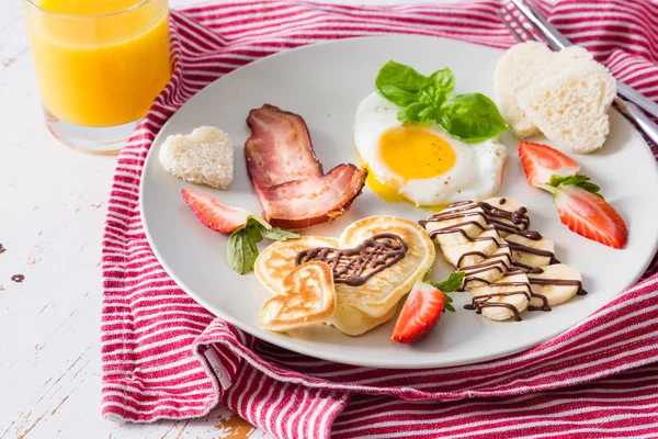 Valentines day breakfast - bacon, egg, pancake, banana
