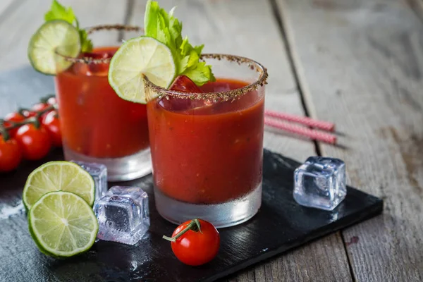 Bloody mary cocktail and ingredients — Stock Photo, Image