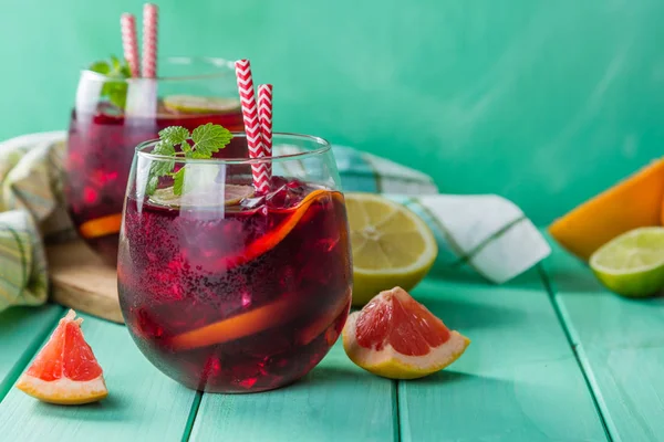 Sangria and ingredients in glasses — Stock Photo, Image