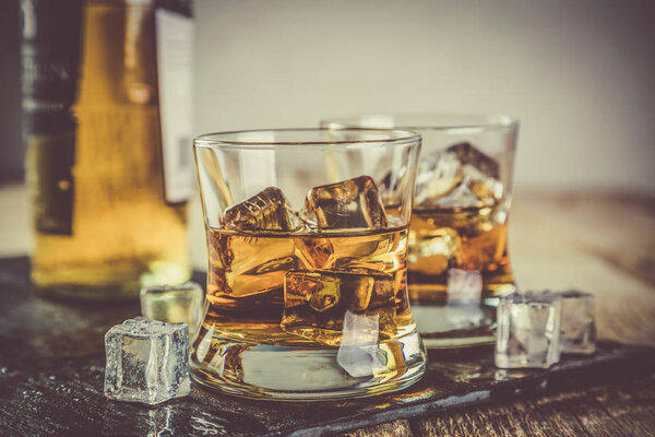 Whiskey with ice in glasses