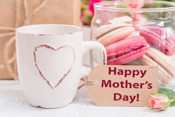 Mothers day card with coffee, present and macaroons