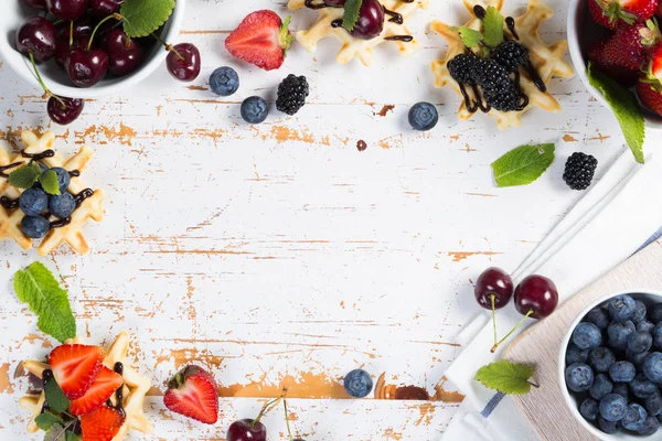 Colorful waffles with different berries — Stock Photo, Image