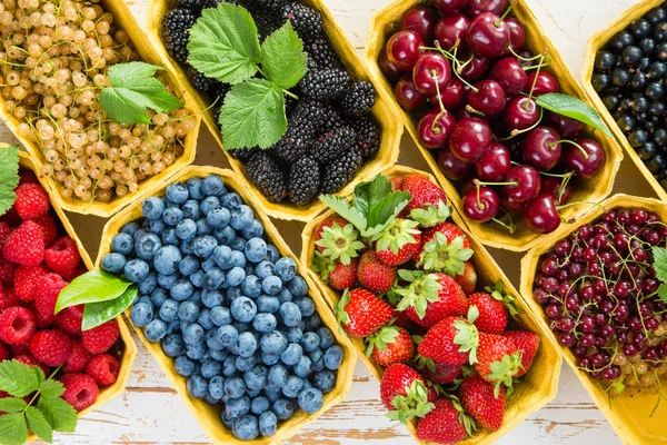 Fresh berries in baskets — Stock Photo, Image