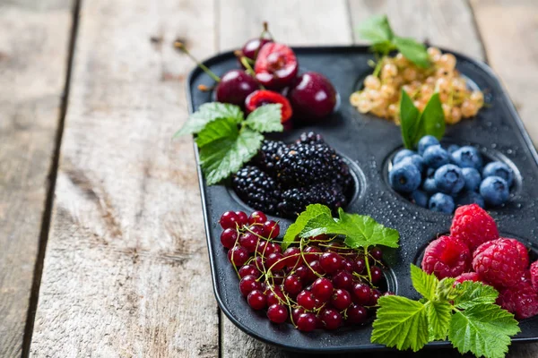 Selection of berries in cupcake form - healthy dessert concept — Stock Photo, Image