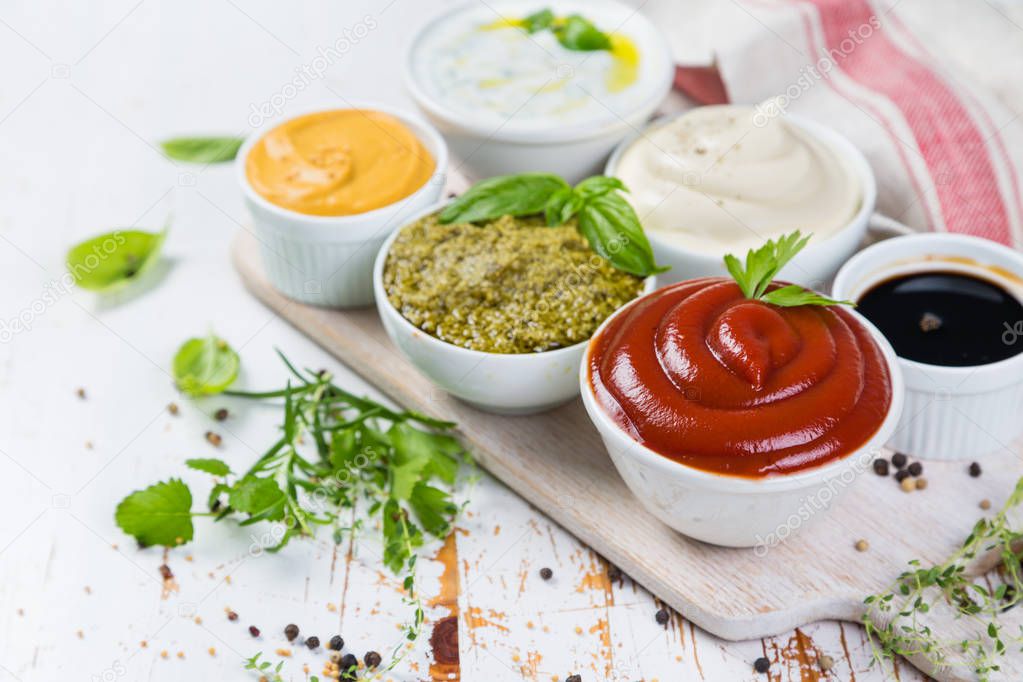 Selection of different sauces in bowls