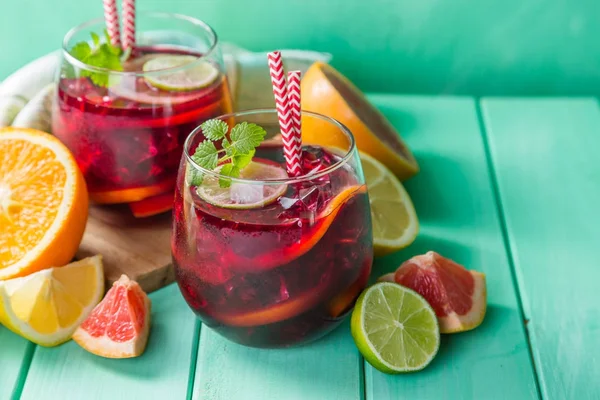 Sangria and ingredients in glasses — Stock Photo, Image