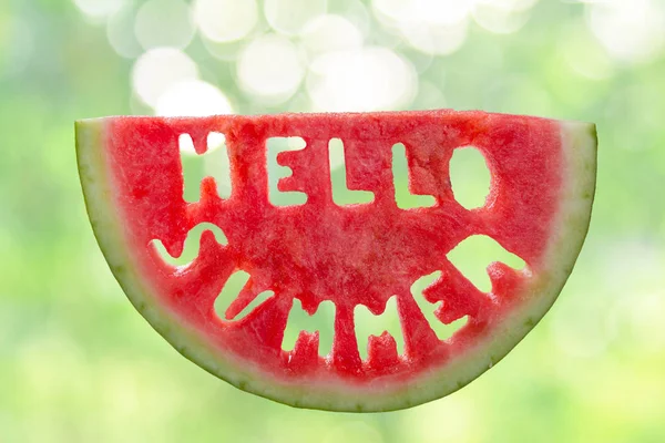 Hello summer concept - letters carved from watermelon