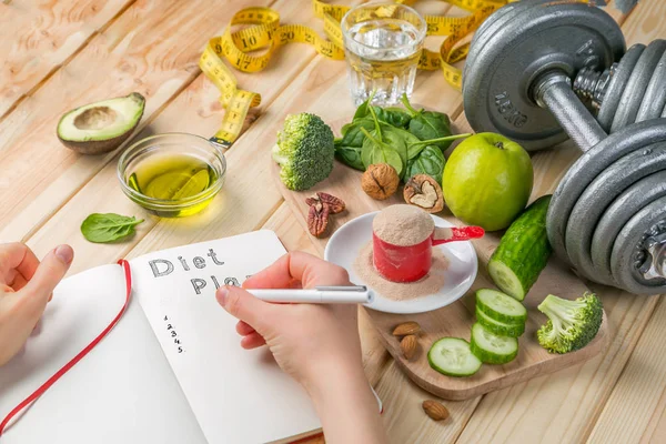 Diet plan concept - selection of green food and note pad — Stock Photo, Image