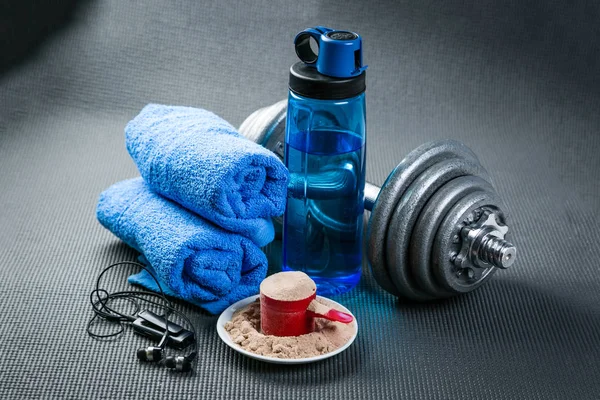 Sport concept - gym supplies on yoga mat background — Stock Photo, Image