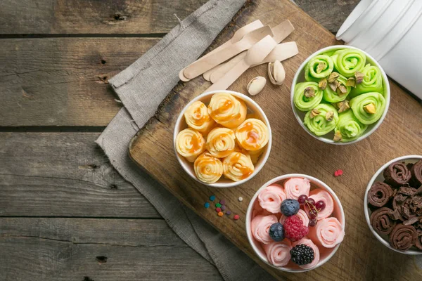 Selection of different rolled ice creams in cone cups — Stock Photo, Image