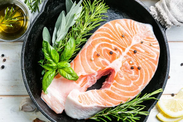 Raw salmon with herbs and spices, rustic background — Stock Photo, Image