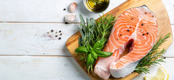 Raw salmon with herbs and spices, rustic background — Stock Photo, Image