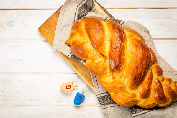 Traditional jewish bread challah on wood background — Stock Photo, Image