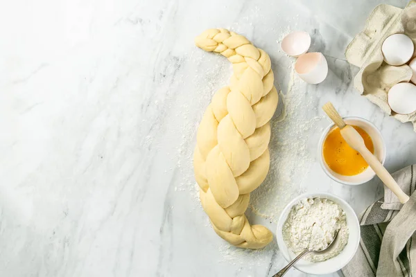 Making traditional jewish challah bread on marble background — Stock Photo, Image