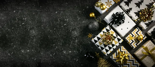 Christmas concept - black and golden presents and decorations — Stock Photo, Image