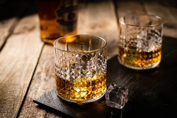 Whiskey in glasses on wood background — 스톡 사진