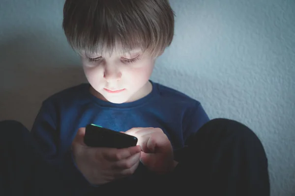 Cyber bullying concept - depressed boy with phone and negative comments — Stock Photo, Image