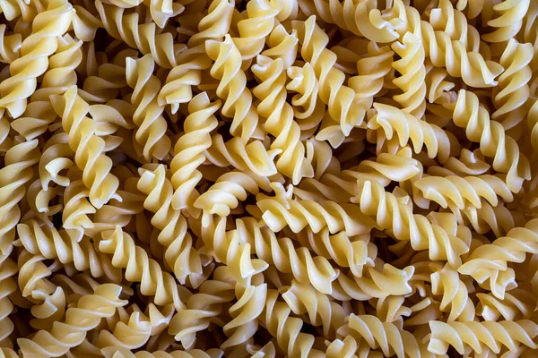 Yellow italian pasta abstract background. Traditional food. — Stock Photo, Image