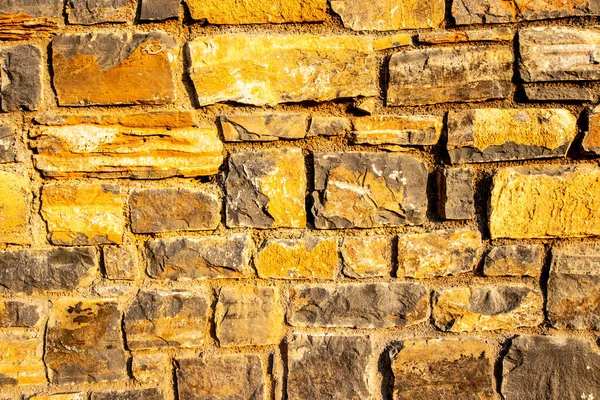 Fondo de la antigua pared de ladrillo de piedra . — Foto de Stock