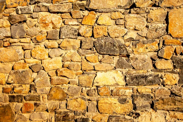 Bakgrund av gamla sten tegelvägg. — Stockfoto