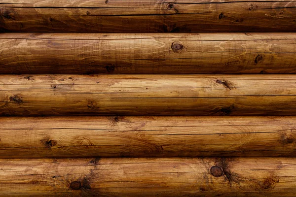 Trä vägg från stockar som bakgrund. — Stockfoto