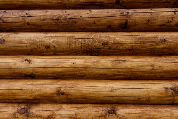 Wooden wall from logs as a background. — Stock Photo, Image