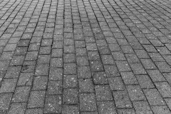 Ladrillo piedra calle camino fondo. Pavimento gris — Foto de Stock