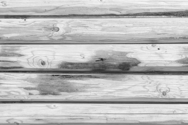 Деревянная стена из бревна в качестве фона — стоковое фото