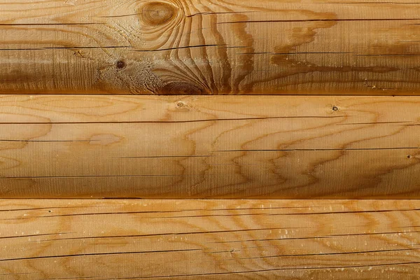 Wooden wall from logs as a background — Stock Photo, Image