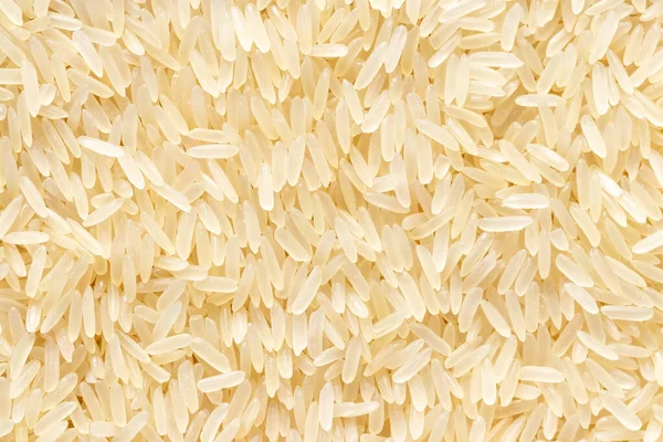 Rice grains background or texture. Healthy vegeterian food.