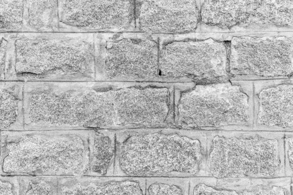 Monochrome background of old stone brick wall. — ストック写真