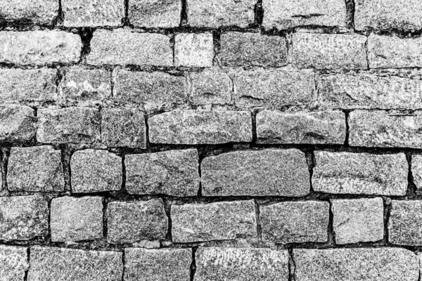 Monochrome background of old stone brick wall.
