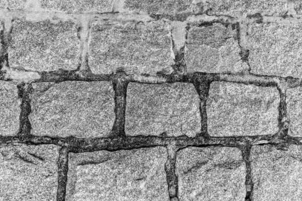 Monokrom bakgrund av gamla sten tegelvägg. — Stockfoto