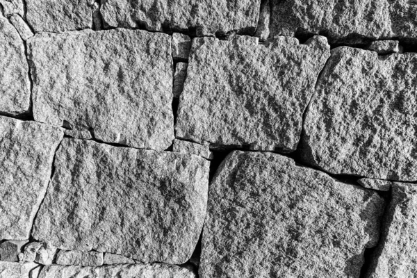 Monochrome background of old stone brick wall.