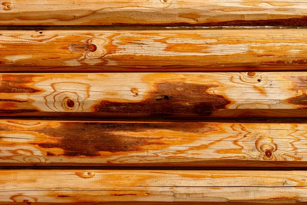 Wooden wall from logs as a background — Stock Photo, Image