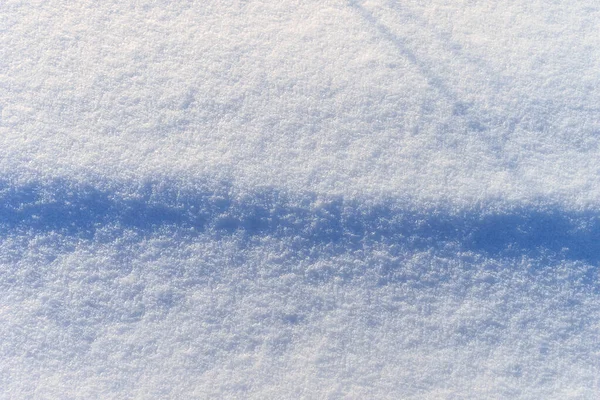 Snö struktur på solig vinterdag. Abstrakt bakgrund. — Stockfoto